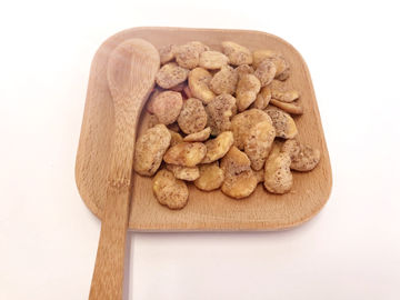 Shell spolverizza lo spuntino rivestito della fava, sapore dell'aglio di nutrizione delle fave